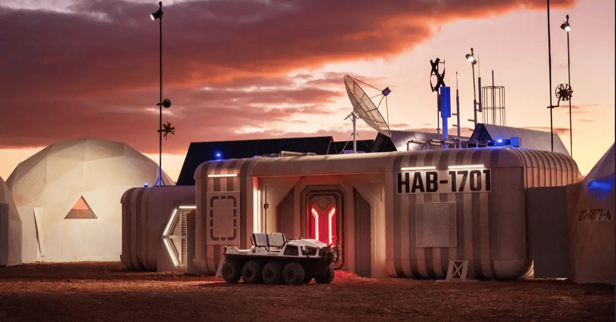 Stars on Mars was filmed in Coober Pedy, South Australia, where producers built the show’s “habitat” on the outskirts of town to take advantage of the region’s Mars-like red desert terrain. The series places celebrities inside a space-simulation base and tracks them 24/7 as they compete in missions and eliminations designed to feel like life on the Red Planet.