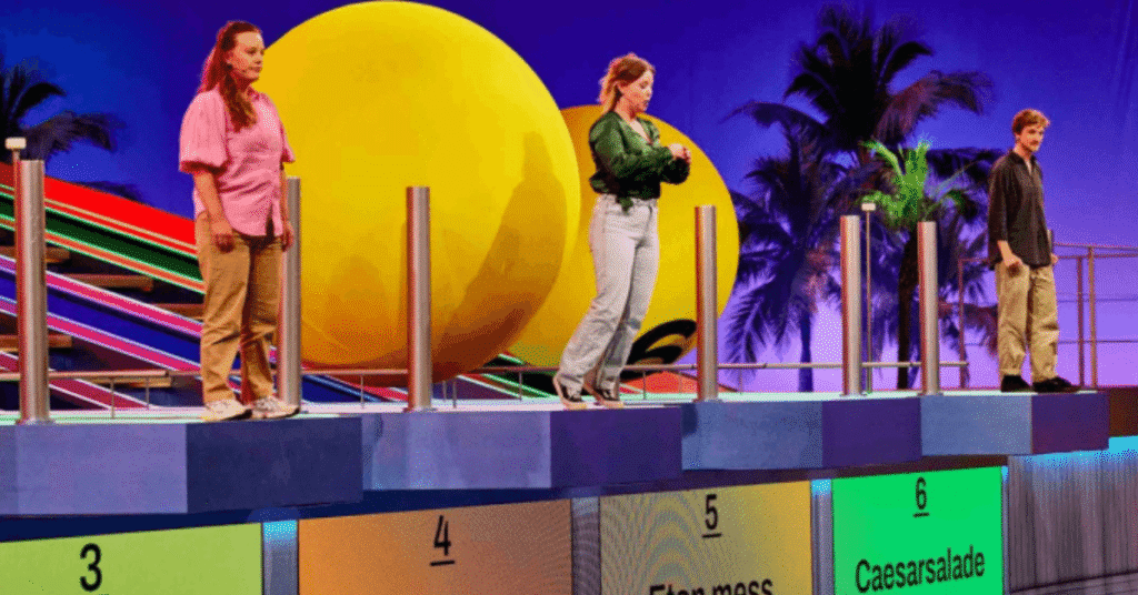 FOX has ordered The Quiz With Balls, a high-energy trivia-meets-physical-competition format from John de Mol’s Talpa Studios and Eureka Productions. The series sees contestants answer questions under pressure—because too many wrong answers can trigger a giant ball that knocks players off the platform and into a pool.